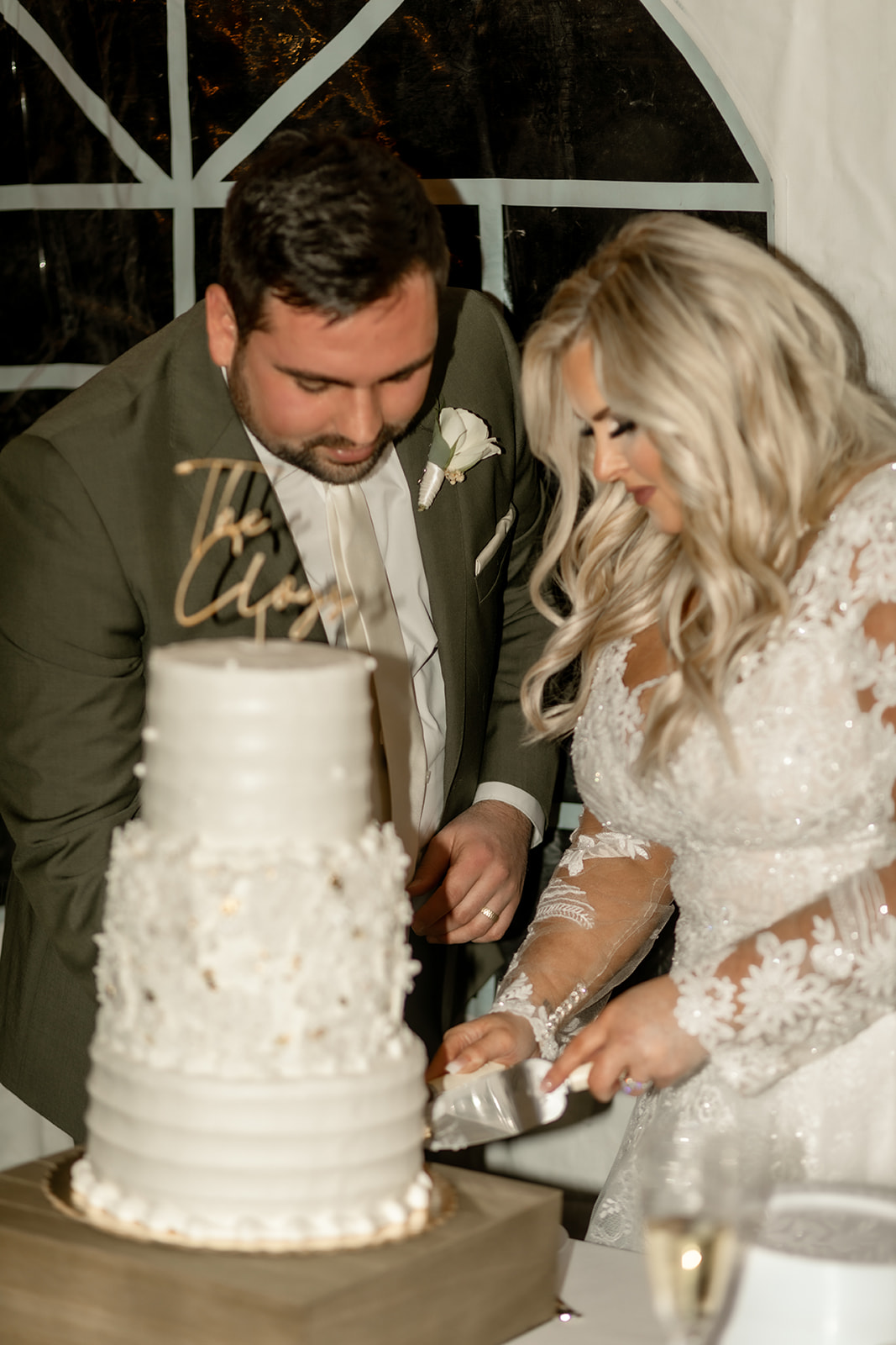 Bride and Groom cutting the cake.