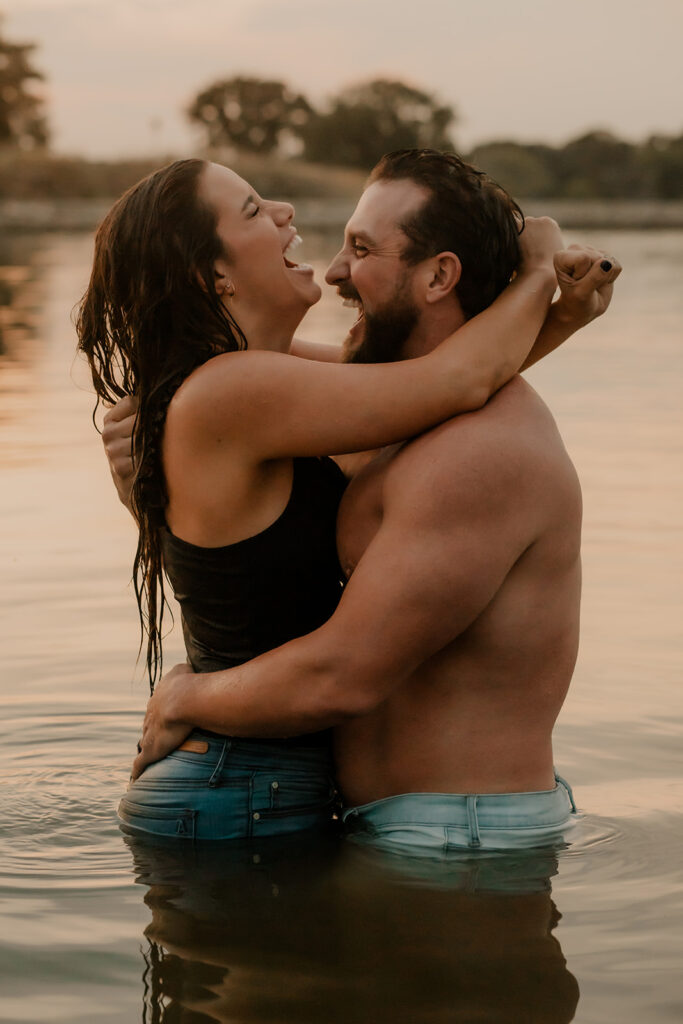 Couple laughing while swimming 