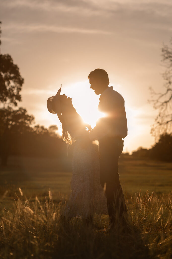 cute couple laughing in sun