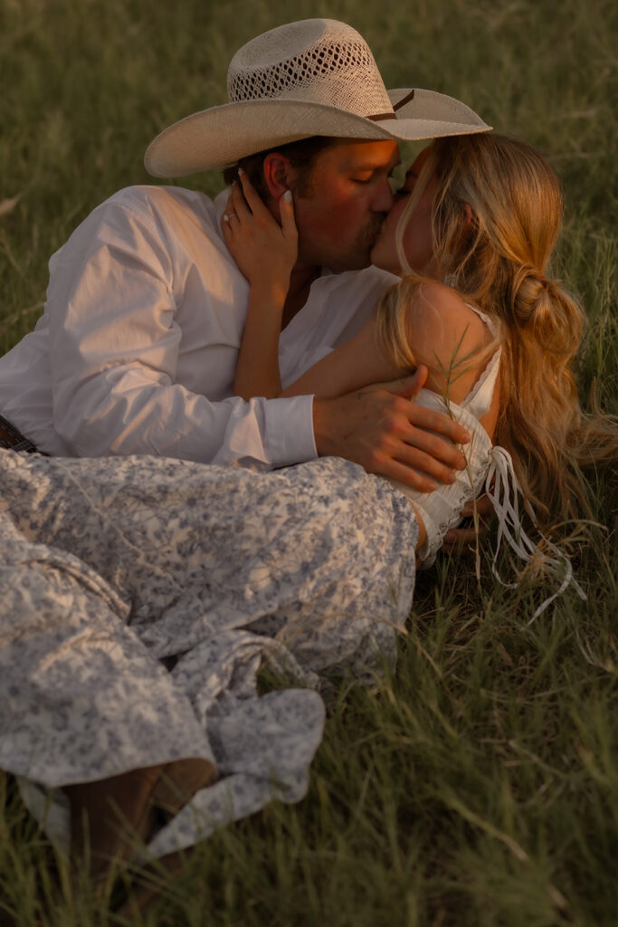 Couple kissing in grass