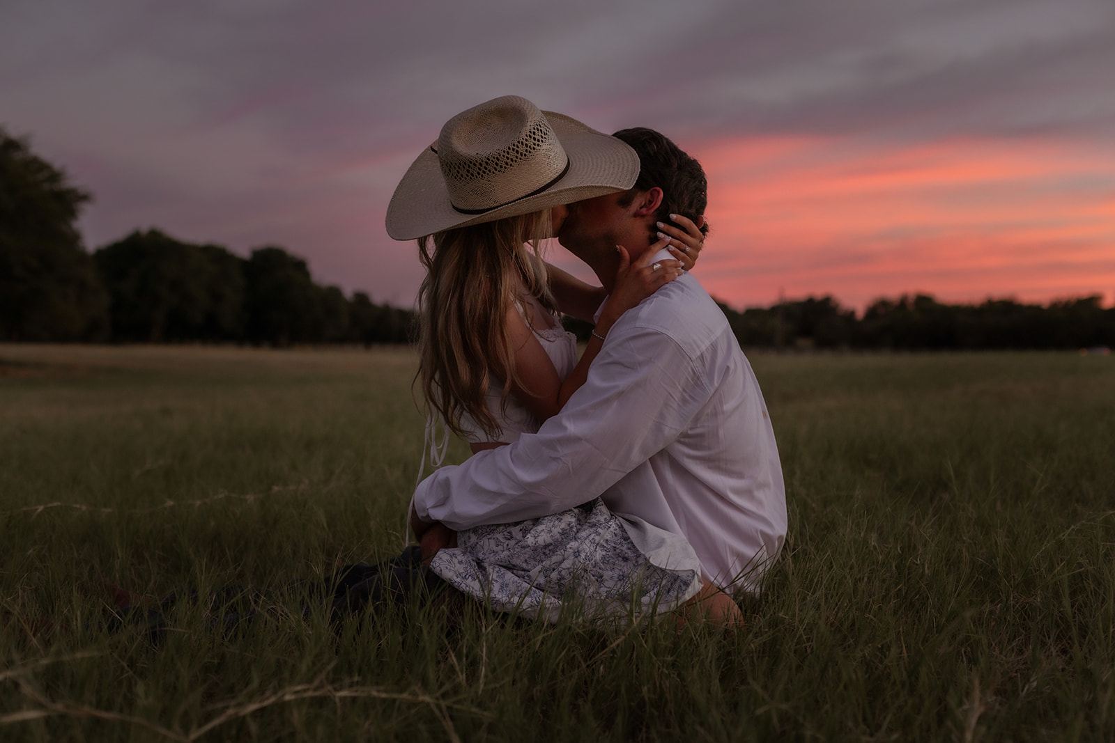 Engagement session, couple kissing, sunset